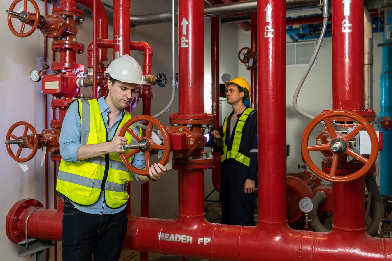 Engineer or technician work checking Fire suppression system and fire equipment.